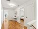 Hardwood floor hallway with doors to bedrooms and a workspace at 1120 Portland Ave # 4, Orlando, FL 32803