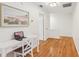 Bright hallway with hardwood floors and a workspace at 1120 Portland Ave # 4, Orlando, FL 32803