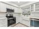 Modern kitchen with stainless steel appliances and white shaker cabinets at 1120 Portland Ave # 4, Orlando, FL 32803