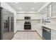 Modern kitchen with stainless steel appliances and white shaker cabinets at 1120 Portland Ave # 4, Orlando, FL 32803