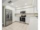 Modern kitchen with stainless steel appliances and white shaker cabinets at 1120 Portland Ave # 4, Orlando, FL 32803