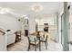 Open living and dining area with a white brick fireplace at 1120 Portland Ave # 4, Orlando, FL 32803