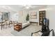 Bright living room features a comfy sofa, dining area, and stylish decor at 1120 Portland Ave # 4, Orlando, FL 32803