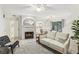Living room with a fireplace, comfy seating, and access to the kitchen at 1120 Portland Ave # 4, Orlando, FL 32803