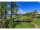 Aerial view of the property showcasing the expansive backyard, landscaping and water views at 11900 Lake Butler Blvd, Windermere, FL 34786