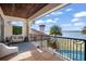 Balcony with wrought iron railing overlooking the pool, backyard, and lake at 11900 Lake Butler Blvd, Windermere, FL 34786