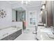 Elegant bathroom with soaking tub, walk-in shower, double vanity, and luxurious finishes at 11900 Lake Butler Blvd, Windermere, FL 34786