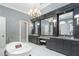 This bathroom features a free standing tub, double vanities, and decorative wallpaper at 11900 Lake Butler Blvd, Windermere, FL 34786