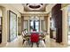 Elegant dining room boasts a statement ceiling, fireplace, and water views at 11900 Lake Butler Blvd, Windermere, FL 34786
