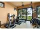 This exercise room has great views of the outdoors and modern exercise equipment at 11900 Lake Butler Blvd, Windermere, FL 34786