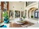 Impressive foyer with grand columns, high ceilings, a chandelier, and views to other areas of the home at 11900 Lake Butler Blvd, Windermere, FL 34786