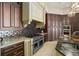 Close up of a custom kitchen with professional grade appliances and granite countertops at 11900 Lake Butler Blvd, Windermere, FL 34786