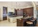 Gourmet kitchen featuring custom cabinetry, granite countertops, and stainless appliances at 11900 Lake Butler Blvd, Windermere, FL 34786