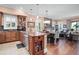 Spacious kitchen and dining area with wood cabinets, hardwood floors, and views of the lake at 11900 Lake Butler Blvd, Windermere, FL 34786