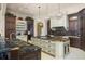 Spacious kitchen with a large island, custom cabinetry, and granite countertops at 11900 Lake Butler Blvd, Windermere, FL 34786