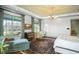 This main bedroom features natural light, a decorative ceiling and a comfortable lounge area at 11900 Lake Butler Blvd, Windermere, FL 34786