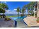 Beautiful pool area featuring comfortable lounge chairs and picturesque lake views on a sunny day at 11900 Lake Butler Blvd, Windermere, FL 34786