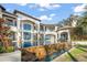 Stunning infinity pool with stone detailing, set against a grand home exterior with a tile roof at 11900 Lake Butler Blvd, Windermere, FL 34786