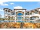 Stunning home featuring a luxurious pool and spa area with a stone wall at 11900 Lake Butler Blvd, Windermere, FL 34786
