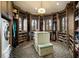 This walk-in closet features custom cabinets, shelving, and a center island at 11900 Lake Butler Blvd, Windermere, FL 34786