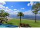 Expansive water view with mature landscaping and palm trees at 11900 Lake Butler Blvd, Windermere, FL 34786