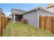 Fenced backyard with patio and grassy area at 13415 Laxness St, Orlando, FL 32827