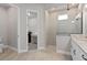 Bathroom with shower, toilet and laundry access at 13415 Laxness St, Orlando, FL 32827