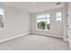 Bright bedroom with large windows and plush carpeting at 13415 Laxness St, Orlando, FL 32827