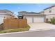Two-car garage with gray exterior and white doors at 13415 Laxness St, Orlando, FL 32827