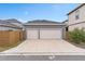 Two-car garage with gray exterior and white doors at 13415 Laxness St, Orlando, FL 32827