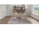 Modern home office with built-in shelving and large window at 13415 Laxness St, Orlando, FL 32827
