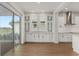 Kitchen features white cabinets, breakfast nook, and sliding glass doors at 13415 Laxness St, Orlando, FL 32827
