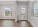 Living room with hardwood floors and access to backyard at 13415 Laxness St, Orlando, FL 32827
