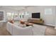 Bright living room with hardwood floors and a neutral color palette at 13415 Laxness St, Orlando, FL 32827