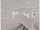 Spacious loft area with neutral carpeting at 13415 Laxness St, Orlando, FL 32827