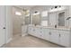 Double vanity bathroom with walk-in shower at 13415 Laxness St, Orlando, FL 32827