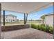 Covered porch with brick flooring and view of the community at 13415 Laxness St, Orlando, FL 32827