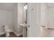 Modern powder room with pedestal sink and toilet at 13415 Laxness St, Orlando, FL 32827