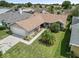 Single-Gathering home with a two-car garage and landscaped yard at 1423 Grand Cayman Cir, Winter Haven, FL 33884