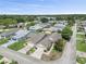 Community view showcasing houses near a lake at 1423 Grand Cayman Cir, Winter Haven, FL 33884
