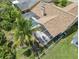 Aerial view of house and pool at 1423 Grand Cayman Cir, Winter Haven, FL 33884