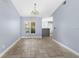 Bright dining room with tile floors and a view into the kitchen at 1423 Grand Cayman Cir, Winter Haven, FL 33884