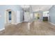 Bright dining room with tile floors and a view into the kitchen at 1423 Grand Cayman Cir, Winter Haven, FL 33884