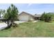 House exterior, front view at 1423 Grand Cayman Cir, Winter Haven, FL 33884