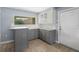 Modern kitchen with gray cabinets and granite countertops at 1423 Grand Cayman Cir, Winter Haven, FL 33884