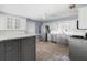 Modern kitchen with stainless steel appliances and an island at 1423 Grand Cayman Cir, Winter Haven, FL 33884
