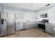 Modern kitchen with stainless steel appliances and granite countertops at 1423 Grand Cayman Cir, Winter Haven, FL 33884