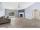 Spacious living room featuring a fireplace and sliding glass doors leading to the backyard at 1423 Grand Cayman Cir, Winter Haven, FL 33884