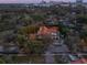 An elevated shot captures the Mediterranean-style home within a backdrop of city and lush greenery at 1446 Berkshire Ave, Winter Park, FL 32789