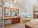 Bright bathroom featuring double vanities, a soaking tub, and shuttered windows providing natural light at 1446 Berkshire Ave, Winter Park, FL 32789